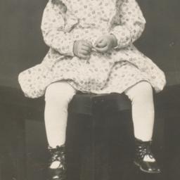 [Child in a Dress Sitting o...