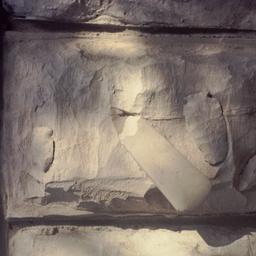 Arrowheads imbedding in stone.