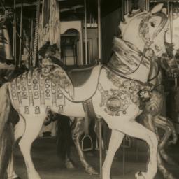 Carousel, with horse carved...