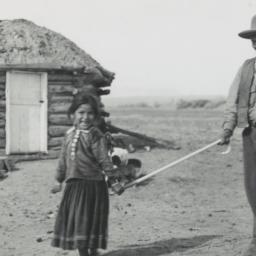 Young Navajo Girl Guiding a...