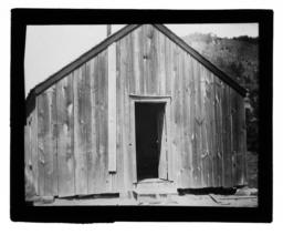 Wooden Building with an Open Door
