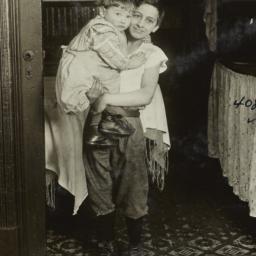 Boy Holding a Small Child