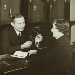 Man Adjusting Eyeglasses fo...