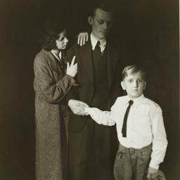 Man Holding Hand of Child