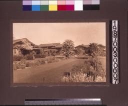 View from garden of outbuildings and rear elevation of main residence.